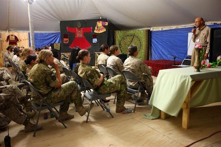 Linguists ‘Essential Part’ of Female Engagement Team Mission Gamaruddin Jabarkhiel (right), the cultural adviser for Regional Command Southwest, speaks to U.S. and U.K. Female Engagement Teams and their linguists during training at the Afghan Cultural Center on Camp Leatherneck, May 16. The FETs met to discuss progress made, share experiences and give advice regarding how to reach out to Afghan women.
