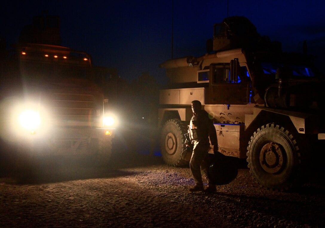 A soldier from the 33rd Georgian Battalion prepares to leave Combat Outpost Shukvani in Helmand province, Afghanistan in a Mine Resistant Armor Protected vehicle on a convoy, April 28. COP Shukvani was recently expanded by 36 Marines and one sailor with 1st Platoon, Engineer Company, Combat Logistrics Battalion 8, 2nd Marine Logistics Group (Forward).