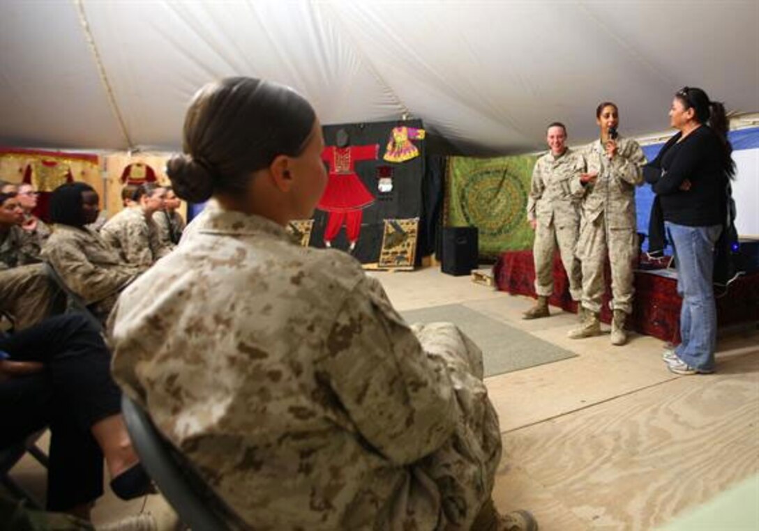 Linguists ‘Essential Part’ of Female Engagement Team Mission Sgt. Habiba Abida (center), a team leader for the Female Engagement Team in Now Zad, speaks to U.S. and U.K. FETs and their linguists during training at the Afghan Cultural Center on Camp Leatherneck, May 16. The FETs met to discuss progress made, share experiences and give advice regarding how to reach out to Afghan women.