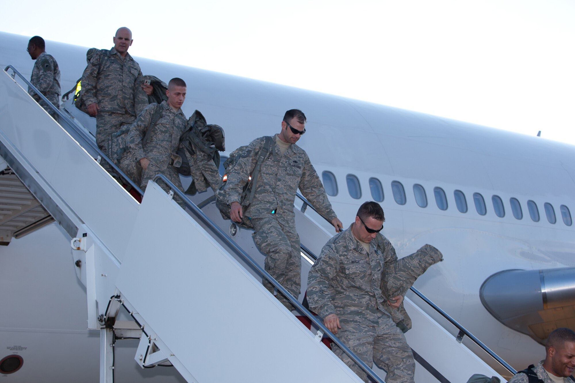 Returning Airman from the 113th DCANG step off from a 18 hours flight from Afghanistan to be greeted back home by Brigadier General Jeff Johnson and Chief  Master Sergeant Ronald Anderson. The Guard members returned home after a 60-day Air Expeditionary Force deployment to Afghanistan in support of Operation Enduring Freedom. Of the 200 deployers, more than 170 were from the District of Columbia Air National Guard???s 113th Wing.  Augmenting the 113th Wing were other Air National Guard members from Iowa, New Jersey, Alabama, and Texas. (U.S.  Air Force photo by Tech Sgt Gareth Buckland/Released)