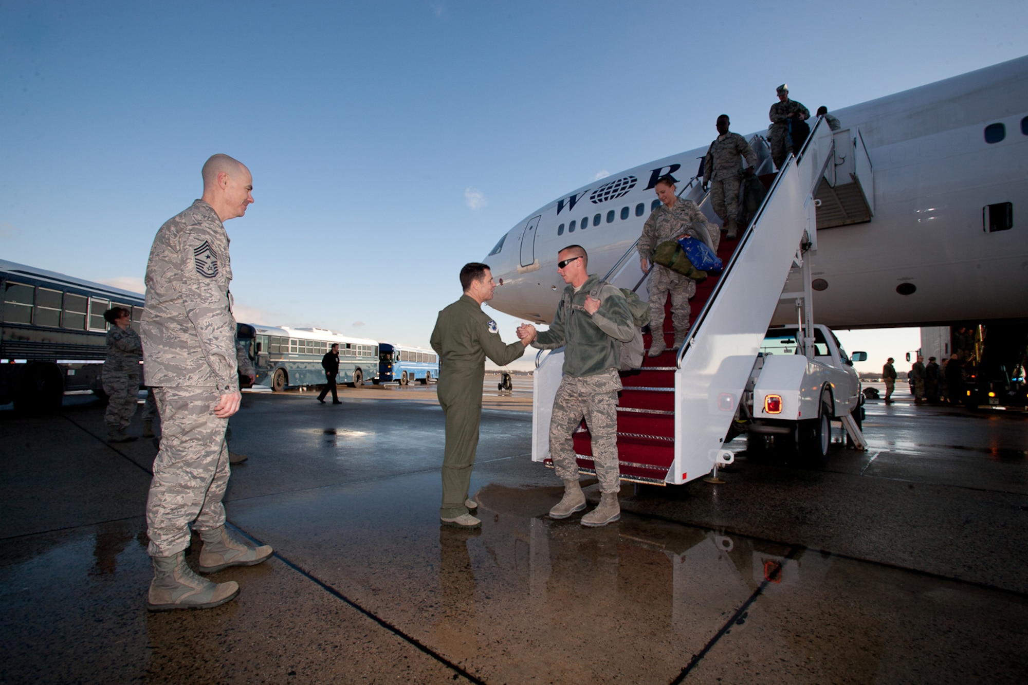 Returning Airman from the 113th DCANG step off from a 18 hours flight from Afghanistan to be greeted back home by Brigadier General Jeff Johnson and Chief  Master Sergeant Ronald Anderson. The Guard members returned home after a 60-day Air Expeditionary Force deployment to Afghanistan in support of Operation Enduring Freedom. Of the 200 deployers, more than 170 were from the District of Columbia Air National Guard???s 113th Wing.  Augmenting the 113th Wing were other Air National Guard members from Iowa, New Jersey, Alabama, and Texas. (U.S.  Air Force photo by Tech Sgt Gareth Buckland/Released)