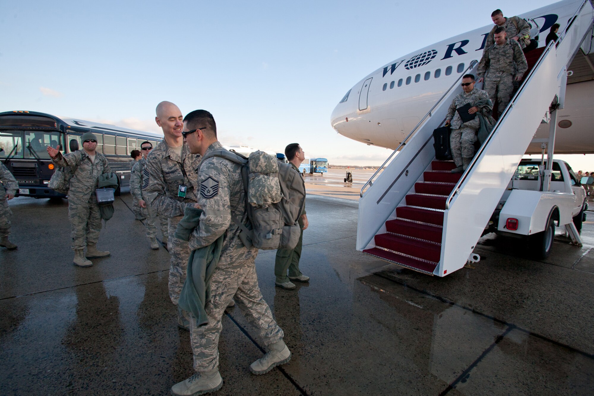 Returning Airman from the 113th DCANG step off from a 18 hours flight from Afghanistan to be greeted back home by Brigadier General Jeff Johnson and Chief  Master Sergeant Ronald Anderson. The Guard members returned home after a 60-day Air Expeditionary Force deployment to Afghanistan in support of Operation Enduring Freedom. Of the 200 deployers, more than 170 were from the District of Columbia Air National Guard’s 113th Wing.  Augmenting the 113th Wing were other Air National Guard members from Iowa, New Jersey, Alabama, and Texas. (U.S.  Air Force photo by Master Sgt. Jessica Dearie/Released)