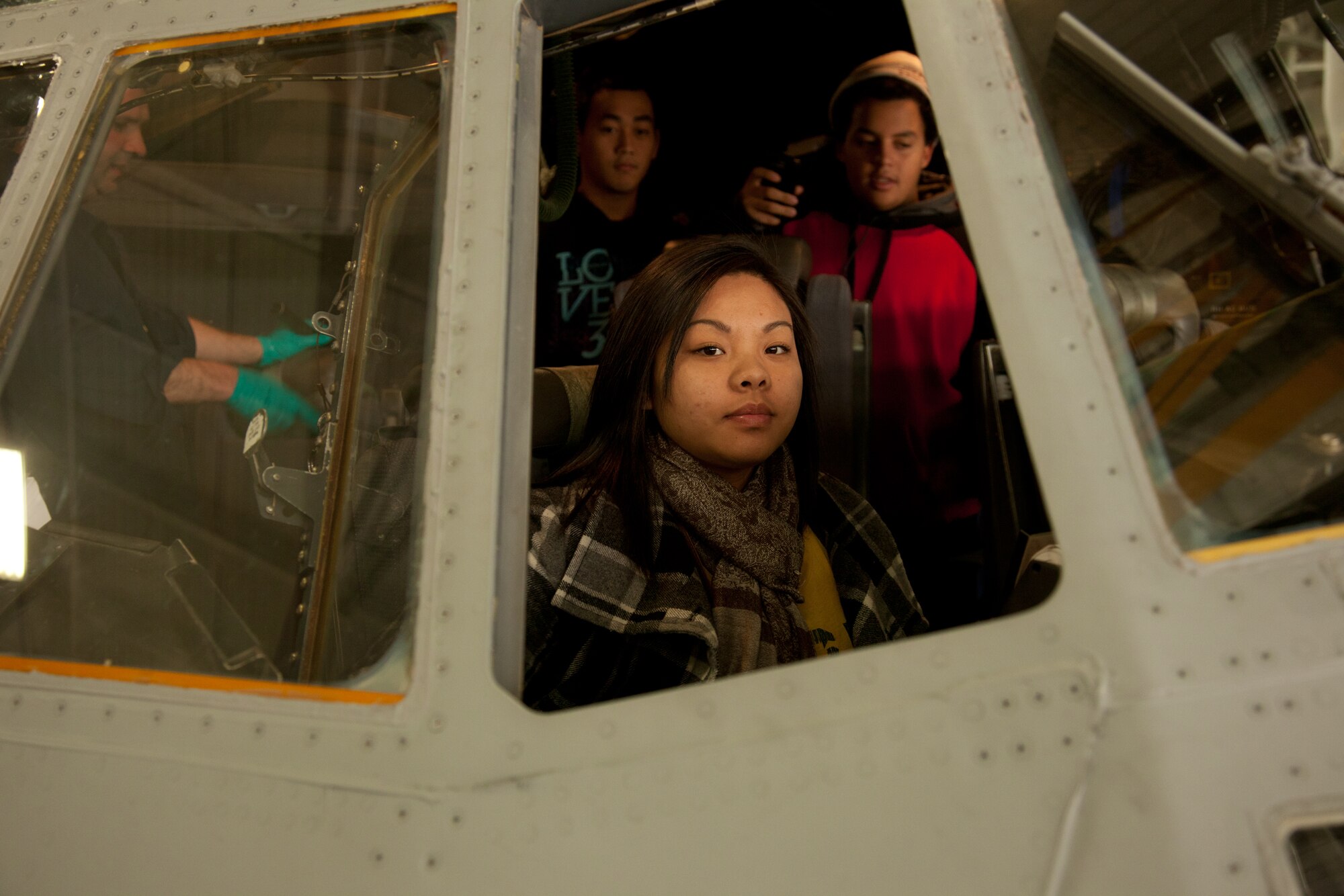 Students from Johnson Senior High School 's Air Force Junior Reserve Officers' Training Corps look out at classmates while getting a hands on experience of the C-130 flight deck.  The students toured the Minneapolis-St. Paul Air Reserve Station and Air National Guard Museum.  The AFJROTC program helps to instill in students in [United States] secondary educational institutions the values of citizenship, service to the United States, and personal responsibility and a sense of accomplishment.  (Air Force Photo/Shannon McKay)