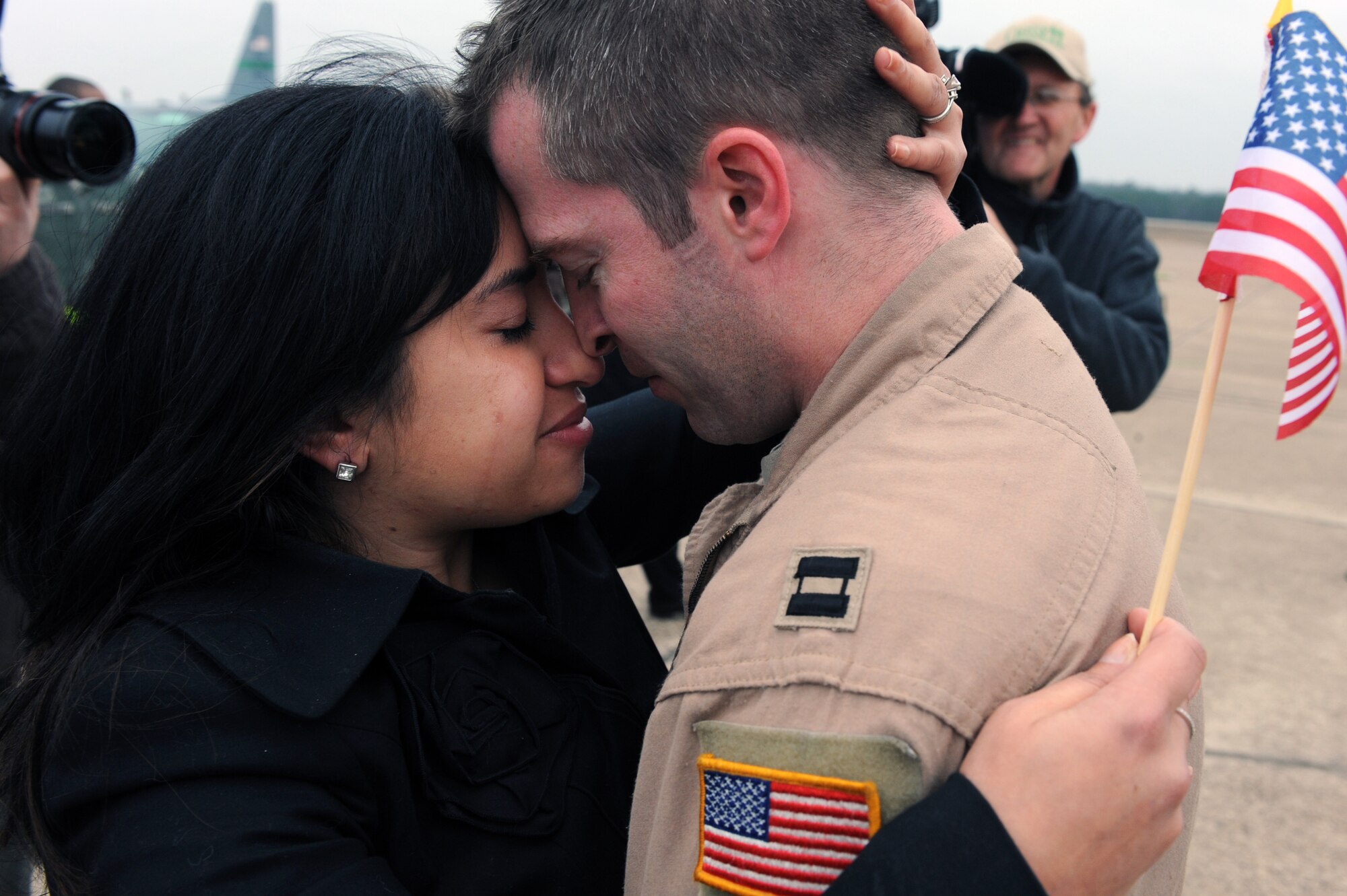 Capt. Evan Zangerle, a 50th Airlift Squadron navigator, embraces his wife Dawn after returning from a deployment Dec. 23, 2011, at Little Rock Air Force Base, Ark. Zangerle returned with more than 80 other Airmen, just in time for the holidays, after supporting combat operations in Southwest Asia. (U.S. Air Force photo by Airman 1st Class Rusty Frank) 