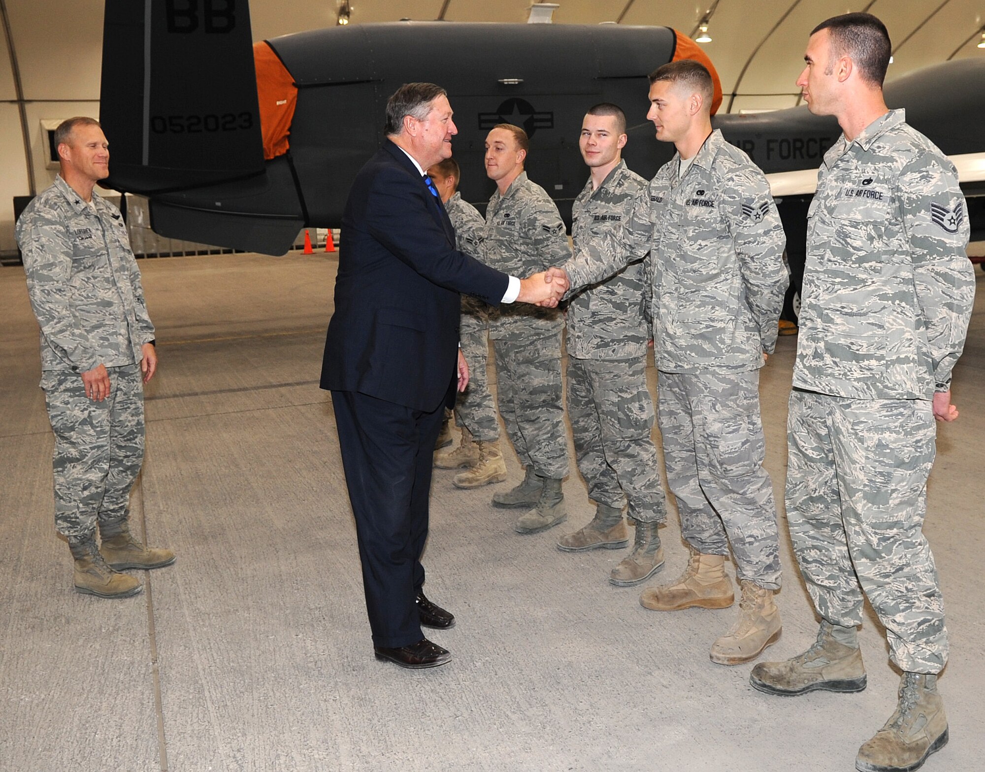 SOUTHWEST ASIA - Secretary of the Air Force Michael Donley meets with RQ-4 Global Hawk maintainers Dec. 23, 2011. During his two-day tour of the 380th Air Expeditionary Wing, Airmen, Soldiers and Sailors briefed the SecAF about current and future operations. (U.S. Air Force photo/Staff Sgt. J.G. Buzanowski)