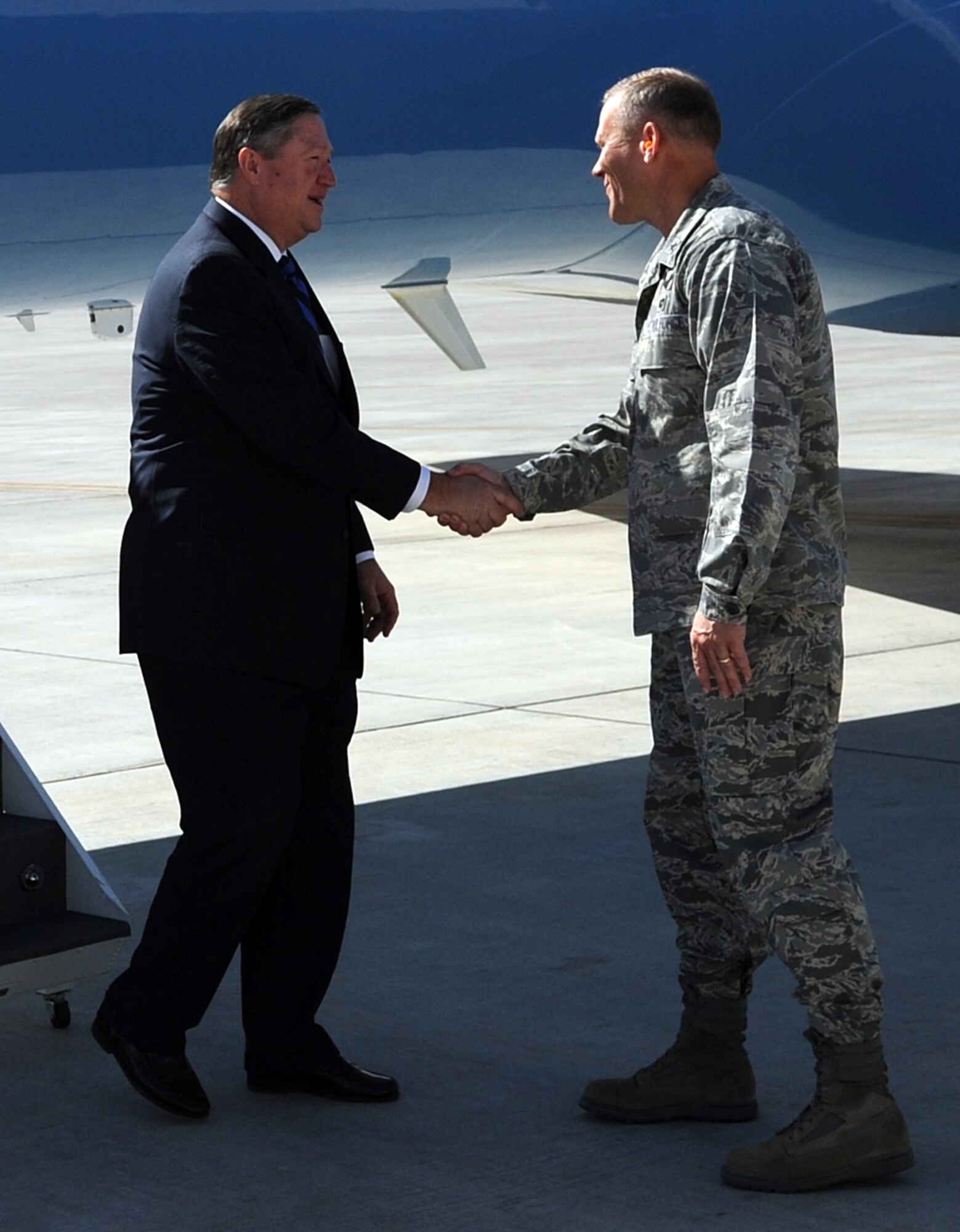 SOUTHWEST ASIA - Brig. Gen. Jeff Lofgren welcomes Secretary of the Air Force Michael Donley Dec. 23, 2011. During the SecAF's two-day tour of the 380th Air Expeditionary Wing, Airmen, Soldiers and Sailors briefed him about current and future operations. (U.S. Air Force photo/Staff Sgt. J.G. Buzanowski)