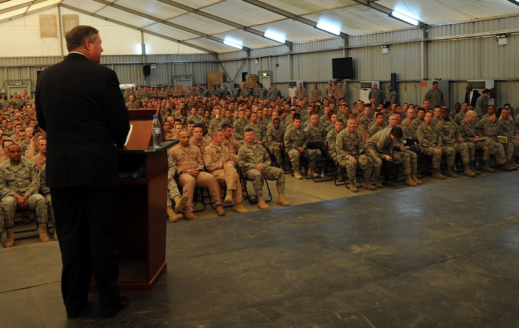 SOUTHWEST ASIA - Secretary of the Air Force Michael Donley speaks to Airmen of the 380th Air Expeditionary Wing Dec. 23, 2011. During his two-day tour of the installation, Airmen, Soldiers and Sailors briefed the SecAF about current and future operations of the wing. In his speech, Donley focused on the importance of building partnerships with joint and coalition partners. (U.S. Air Force photo/Staff Sgt. J.G. Buzanowski)