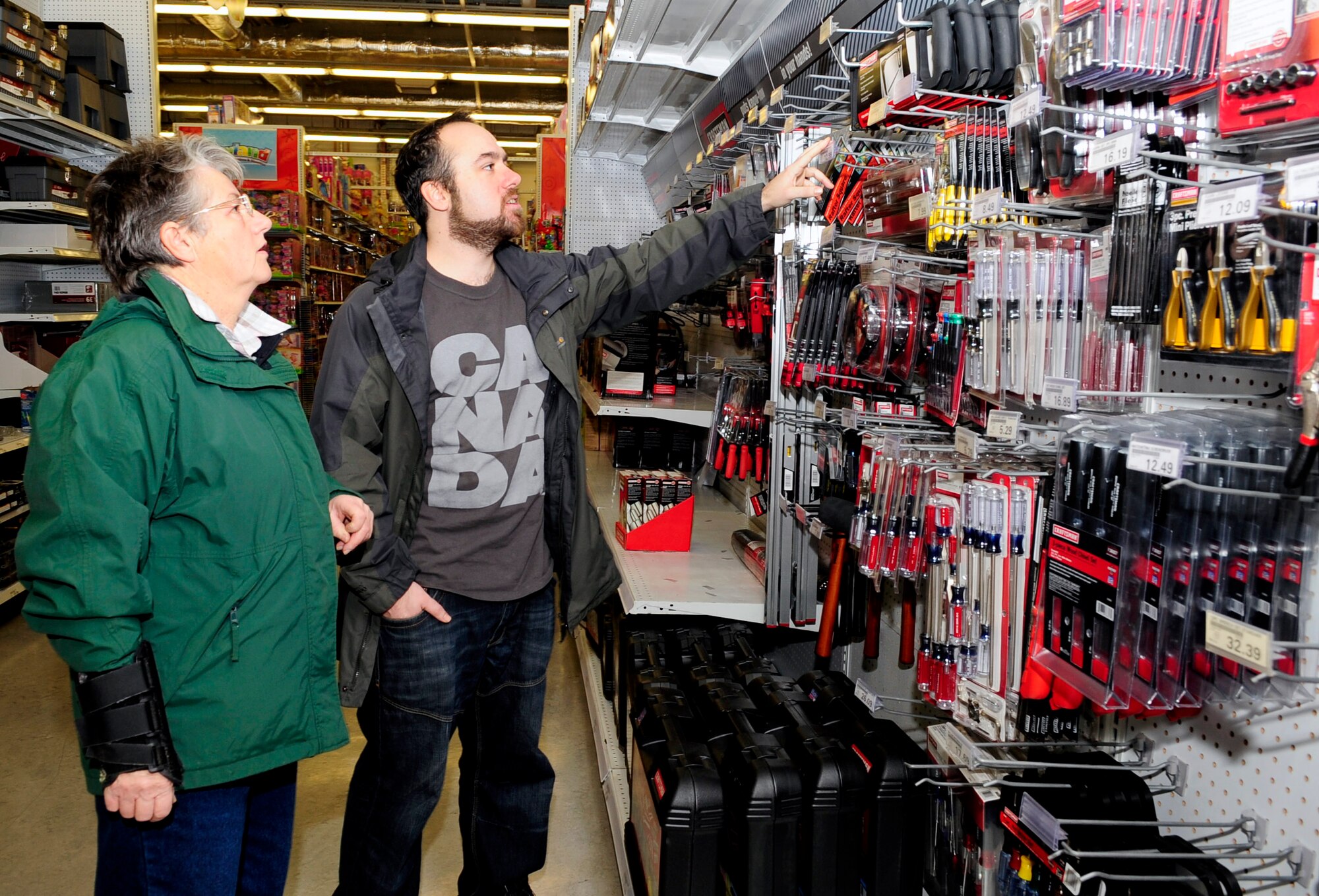 RAF MILDENHALL, England – Joan and Brendon Neville complete last-second Christmas shopping at the Exchange here Dec. 23, 2011. Many shoppers purchased their final items in the last days of the holiday shopping season, including gifts that will be donated to needy families by base private organizations. (U.S. Air Force photo/Senior Airman Ethan Morgan)