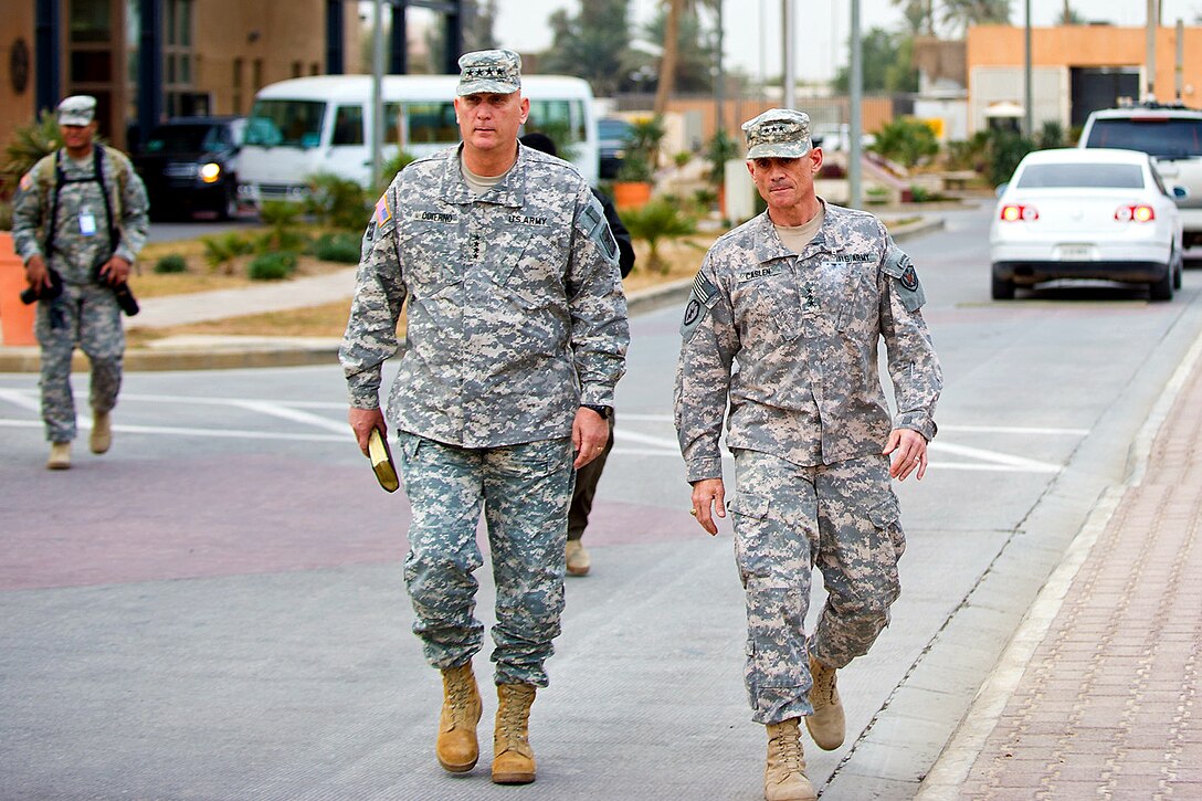 U.S. Army Lt. Gen. Robert L. Caslen Jr., right, walks with U.S. Army Chief of Staff Gen. Raymond T. Odierno, at Baghdad International Airport in Baghdad, Dec. 22, 2011. Caslen is the commanding general of the Office of Security Cooperation-Iraq.