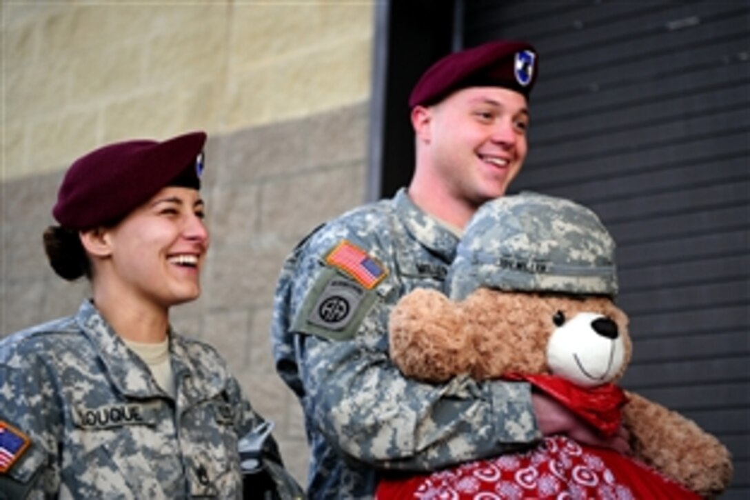 Soldiers line up to participate in the 14th annual Operation Toy Drop on Pope Field, N.C., Dec. 9, 2011. The soldiers are paratroopers assigned to the 82nd Airborne Division. The toy drop is an annual event where soldiers donate new, unwrapped toys for a chance to train and jump with international jumpmasters. The donated toys are distributed to underprivileged children within the community.