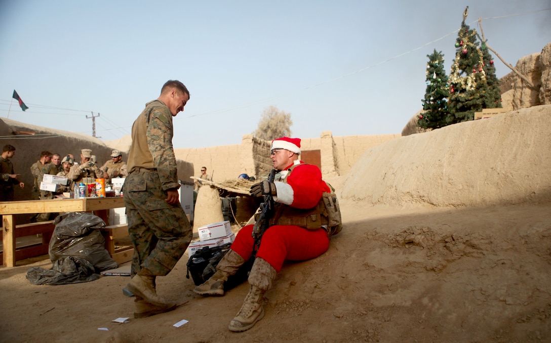 Sgt. Maj. Larry J. Harrington, battalion sergeant major, 1st Battalion, 6th Marine Regiment, sits at Patrol Base Florida, Sangin District, Dec. 23. Harrington, along with the battalion commander, and members of their Personal Security Detail, visited patrol bases and observation posts across the battalion’s area of operations, bringing presents and gifts to Marines in celebration of the holiday.