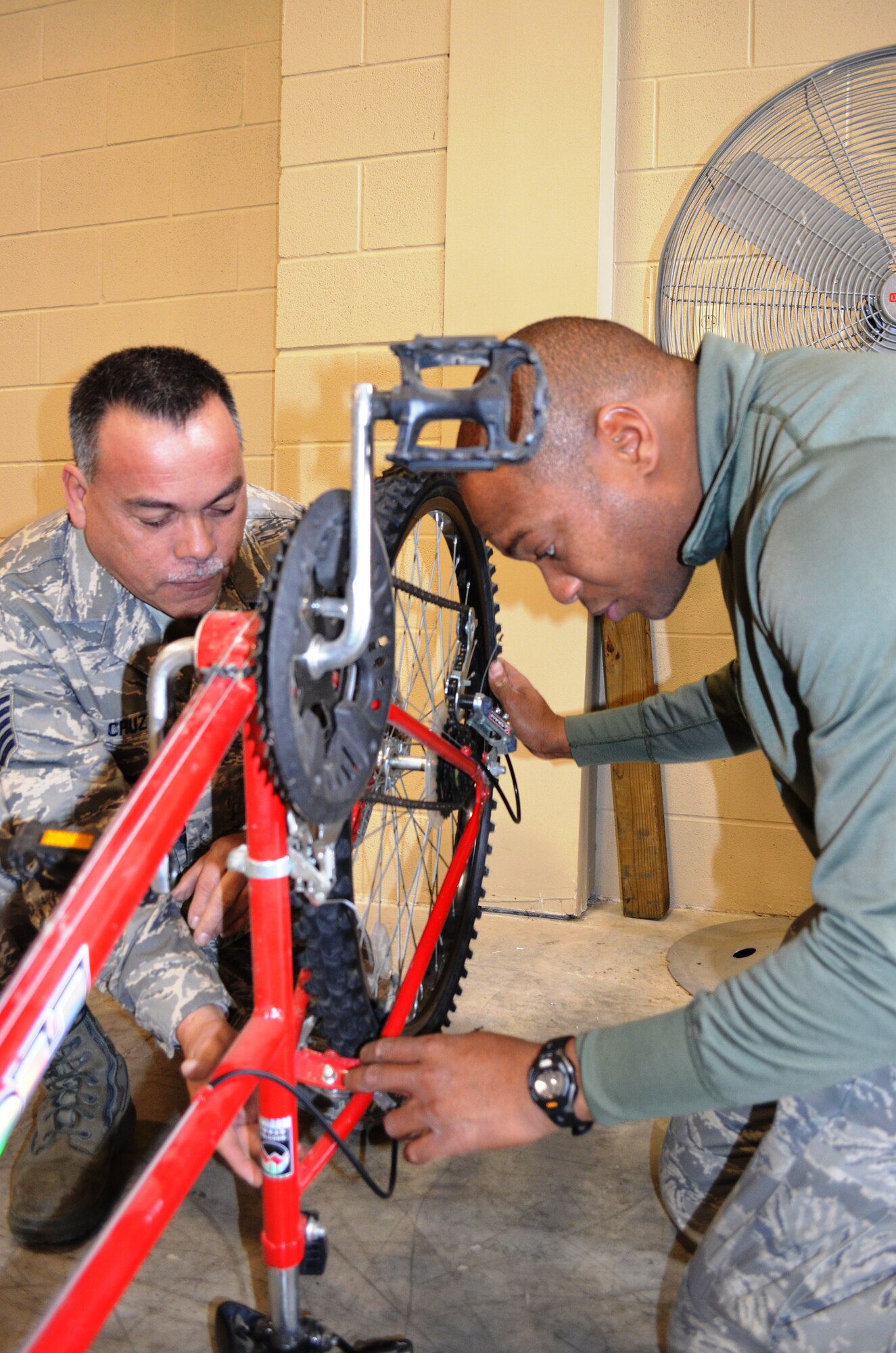Tech Sgt. James Cruz and Master Sgt. Brian Boyd, 433rd AMXS, do some last minute maintenance on one of the 63 bikes donated by the 433rd Airlift Wing. For the third consecutive year, the Alamo Wing Top Three gathered bikes and safety equipment to donate to children in need. Youth were selected on the basis of participation, behavior, and grades by Boys & Girls Club staff members from branches throughtout San Antonio, Texas. (U.S. Air Force photo/ Tech Sgt. Carlos J. Trevino)  