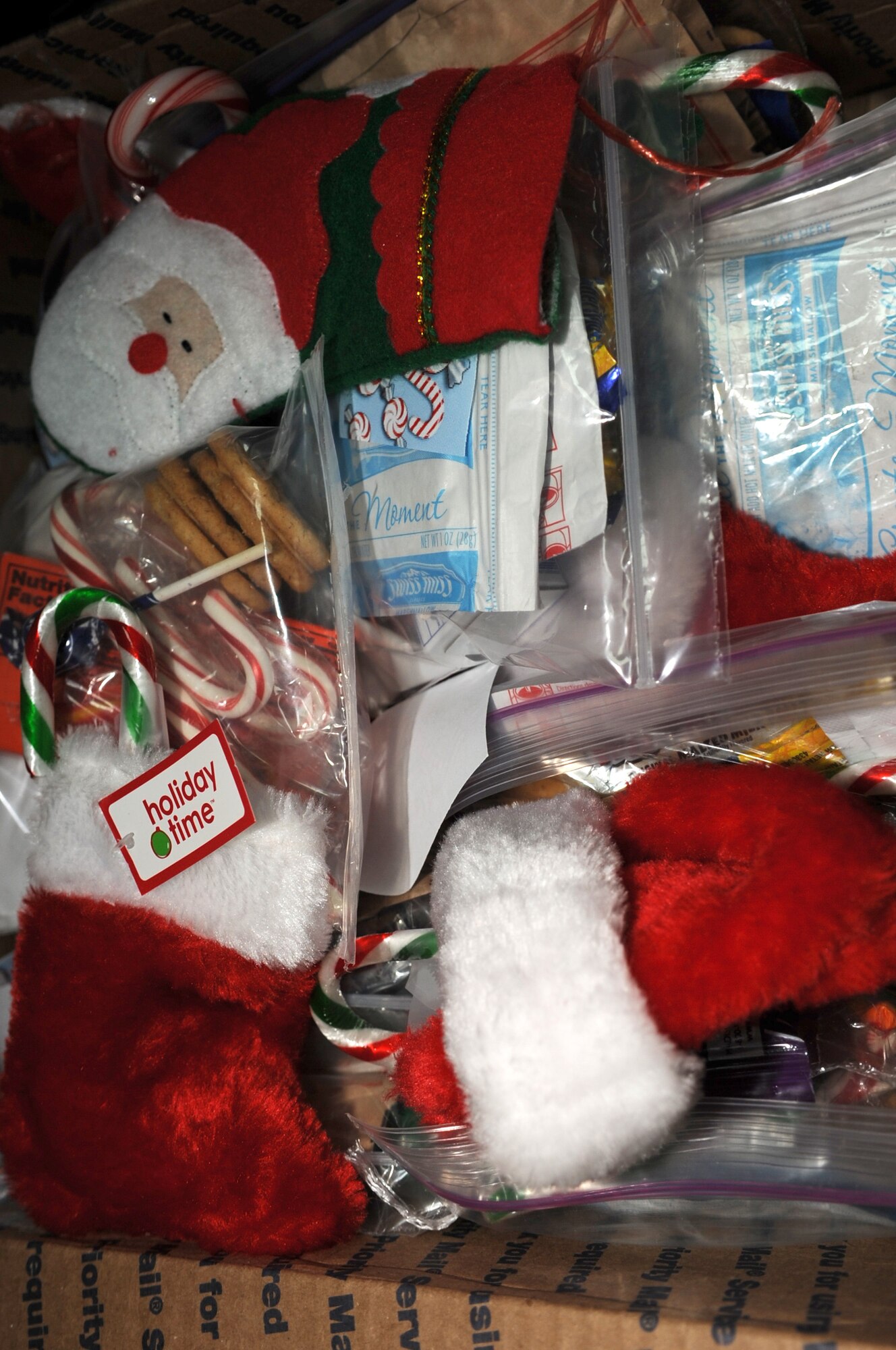 SOUTHWEST ASIA - Stockings sit in a box as the chapel staff hands them out to members of the 380th Air Expeditionary Wing Dec. 22, 2011. Over the past several weeks, the chapel staff collected thousands of items for their Operation: Holiday Blitz. Roughly 40 volunteers helped the staff put together stockings for everyone deployed here. (U.S. Air Force photo/Staff Sgt. J.G. Buzanowski)