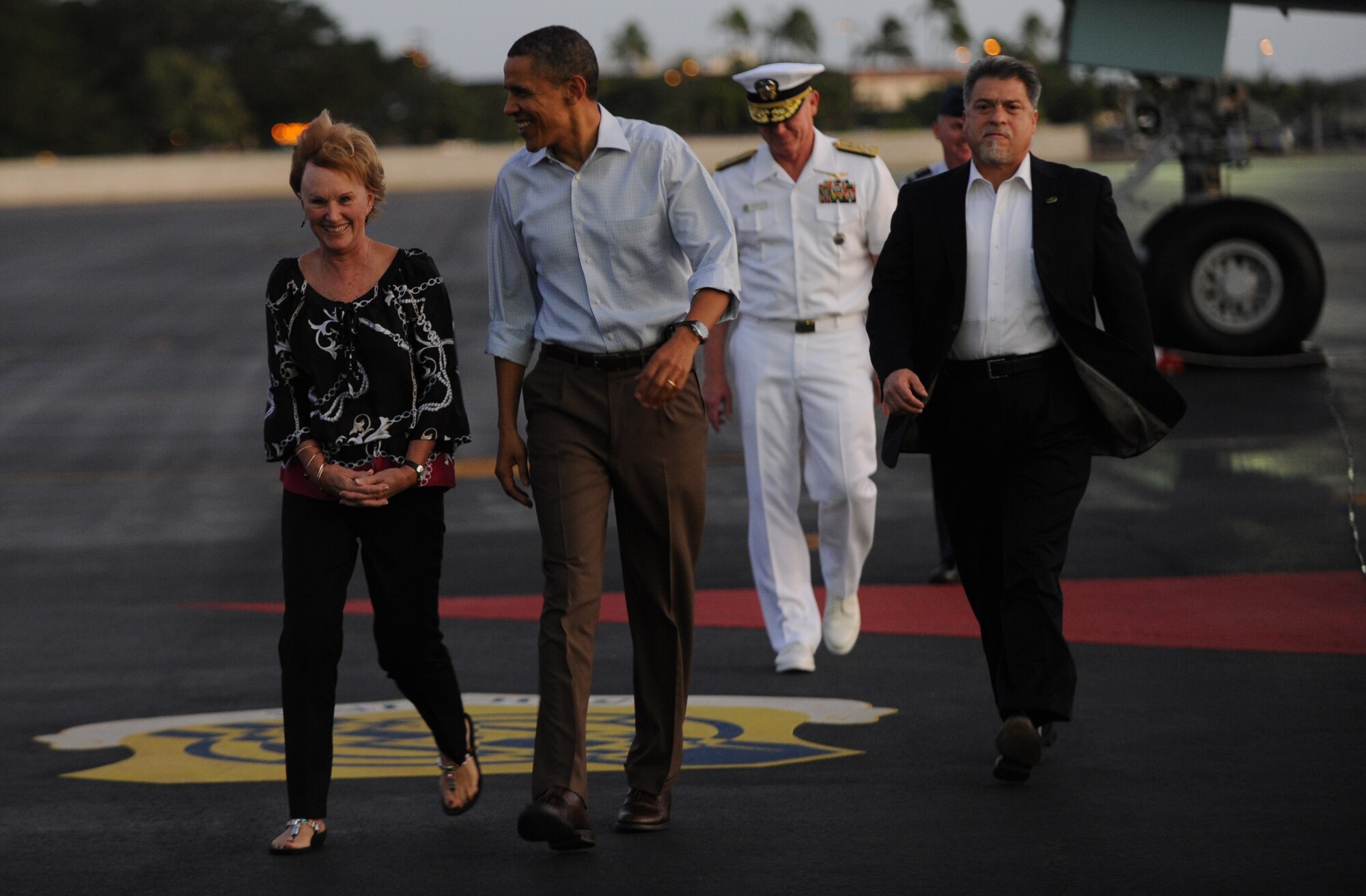 President Barack Obama is greeted by Donna Willard, wife of Adm. Robert Willard, commander of U.S. Pacific Command, upon arrival at Joint Base Pearl Harbor-Hickam, Hawaii, Dec. 23. Obama and his family are expected to stay in Hawaii through the new year's holiday. (U.S. Air Force photo/Airman Senior Airman Lauren Main)

