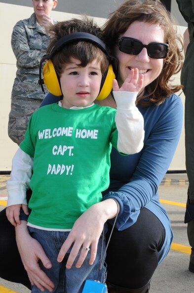 SEYMOUR JOHNSON AIR FORCE BASE, N.C. – Stephanie and son Edward Francis, 2, waves as his dad Capt. Taylor “Latch” Francis taxis to his designated parking spot after returning from Bagram Airfield, Afghanistan to Seymour Johnson AFB, N.C., Dec. 22, 2011. Edward’s dad was one of more than 100 Airmen to return just in time to spend the holidays with their families. Francis hails from Manteo, N.C. (U.S. Air Force photo by Staff Sgt. Courtney Richardson)
