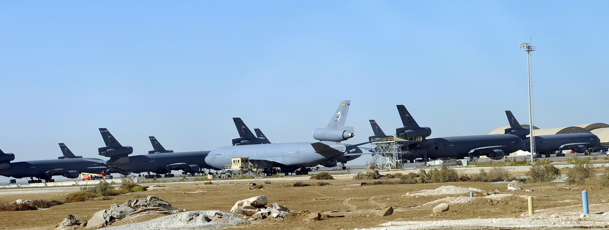 SOUTHWEST ASIA - KC-10 Extender tanker aircraft sit on the 380th Air Expeditionary Wing flightline Dec. 23, 2011. The KC-10s, deployed from Travis Air Force Bse, Calif., and Joint Base McGuire-Dix-Lakehurst, N.J., provide refueling for joint and coalition aircraft throughout the U.S. Central Command area of responsibility. Extender crews flew more than 4,000 missions, providing roughly 35 percent of all air refueling this year. (U.S. Air Force photo/Staff Sgt. J.G. Buzanowski)