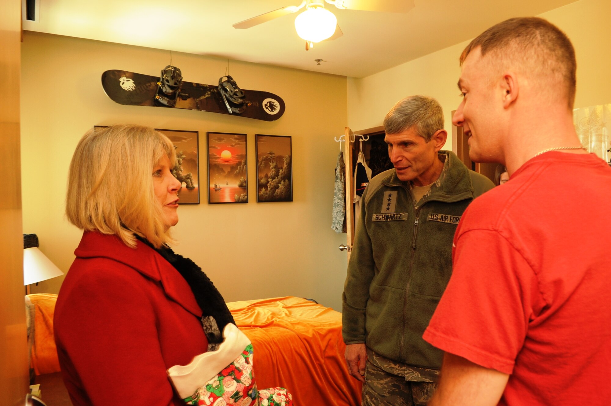 Air Force Chief of Staff Gen. Norton Schwartz and his wife Suzie talk with Staff Sgt. Trinity Hayes, 8th Maintenance Squadron, during a visit to the dormitories at Kunsan Air Base, Republic of Korea, Dec. 24, 2011. The couple visited the dorms at Kunsan to see first-hand the quality of life and living conditions for Airmen stationed at Kunsan. (U.S. Air Force photo by Master Sgt. Sonny Cohrs/Released)