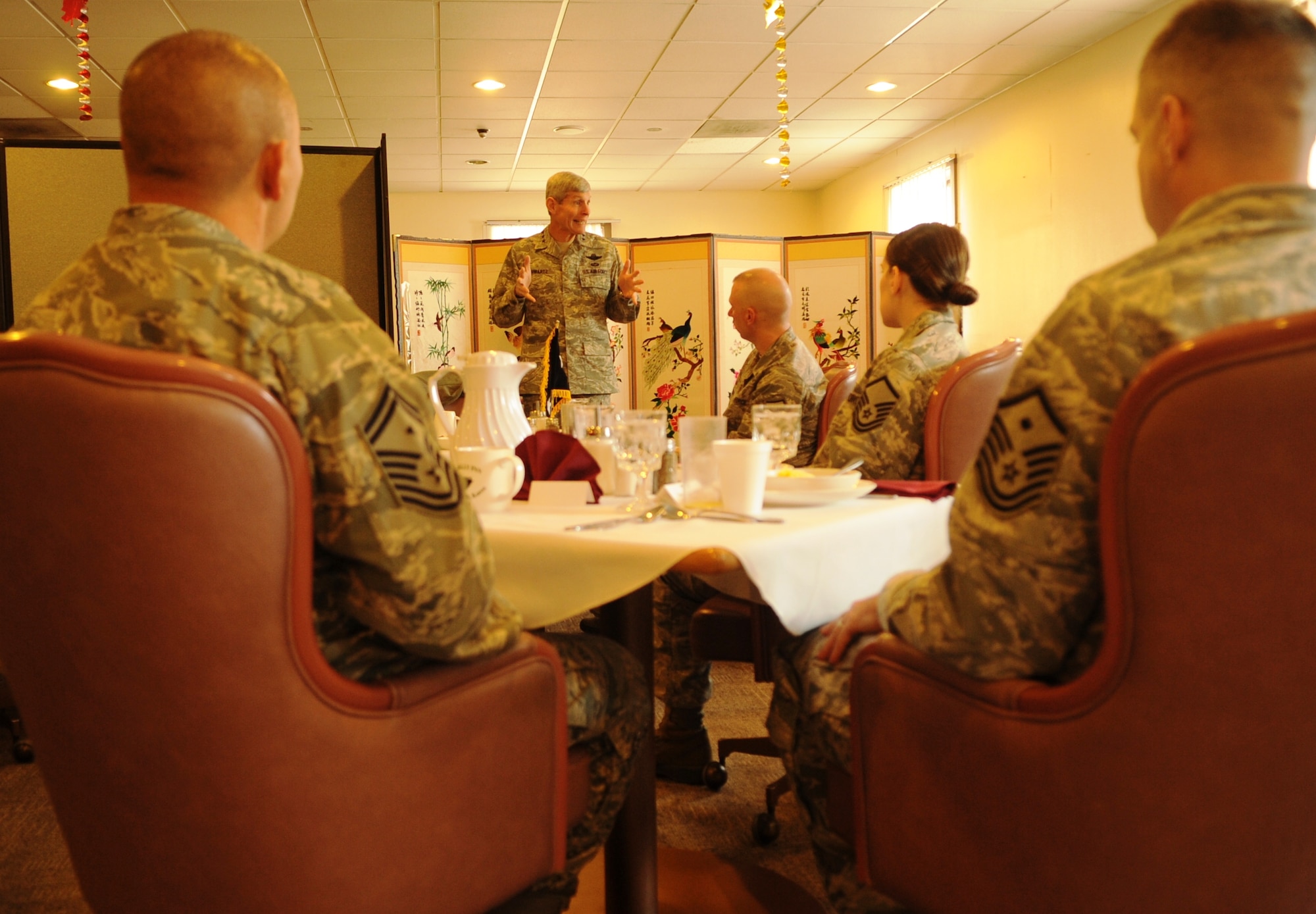 Air Force Chief of Staff Gen. Norton Schwartz talks with 8th Fighter Wing first sergeants during breakfast Dec. 24, 2011, as part of his visit to Kunsan Air Base, Republic of Korea. The general and his wife visited Kunsan during the holidays to spend time and spread holiday cheer to Airmen serving on a remote, one-year assignment on the Korean peninsula. (U.S. Air Force photo by Master Sgt. Sonny Cohrs/Released)