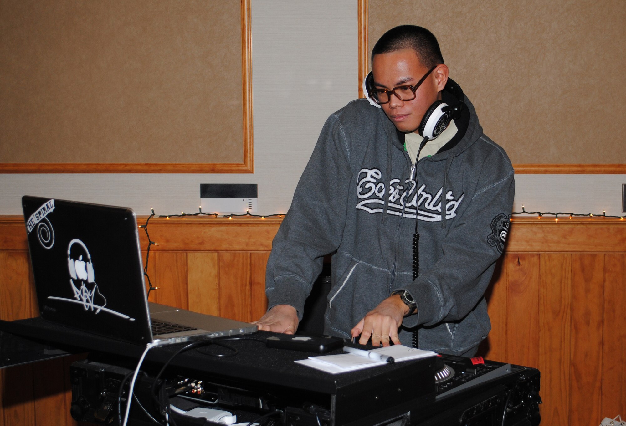Senior Airman John Adapon , 341st Medical Operations Squadron medical technician, acts as the DJ during the wrap-up party. 