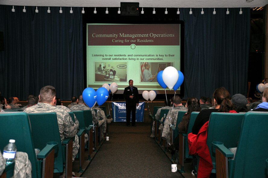 Pat Hoppaugh, Balfour Beatty Communities Western Group area community manager, discusses housing privatization with Team Malmstrom during a town hall meeting Dec. 15 at the base theater. Two meetings were held to introduce Airmen and their families to the process of housing privatization and Balfour Beatty Communities housing management company. 