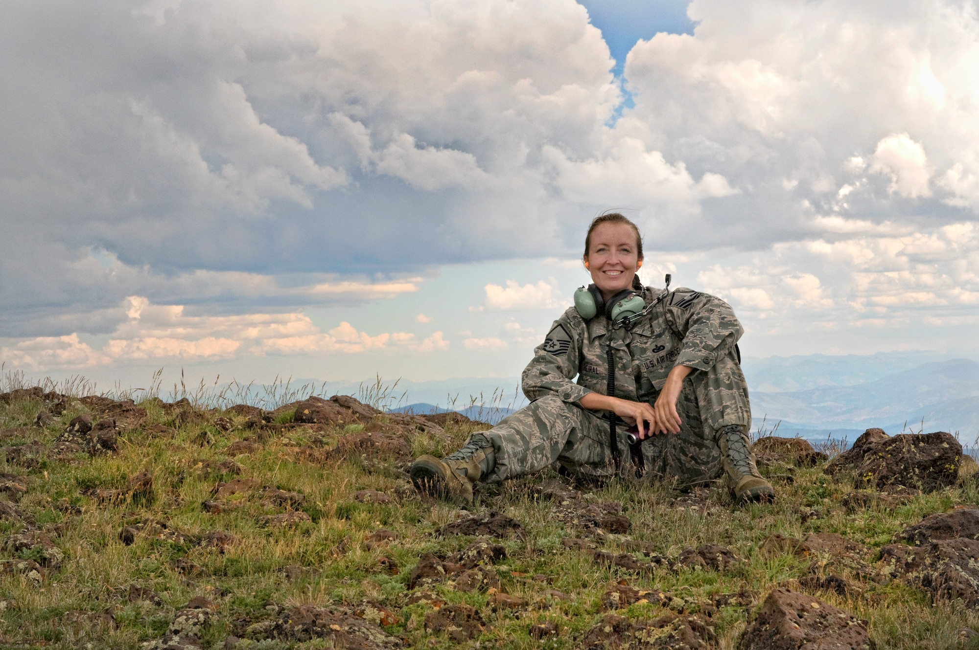 The author: Colorado Air National Guard Master Sgt. Cheresa D. Theiral gets some fresh air atop Dome Peak, a landing zone at 12,200 feet above sea level, Aug. 25, 2011, while waiting for the UH-60 Black Hawk helicopter she rode there on to return. Theiral is working on a story series about the Colorado Army National Guard’s High-altitude Army National Guard Aviation Training Site in Gypsum, Colo. (Photo © 2011 Deborah Grigsby Photography | www.deborahgrigsby.com) (Used with permission)