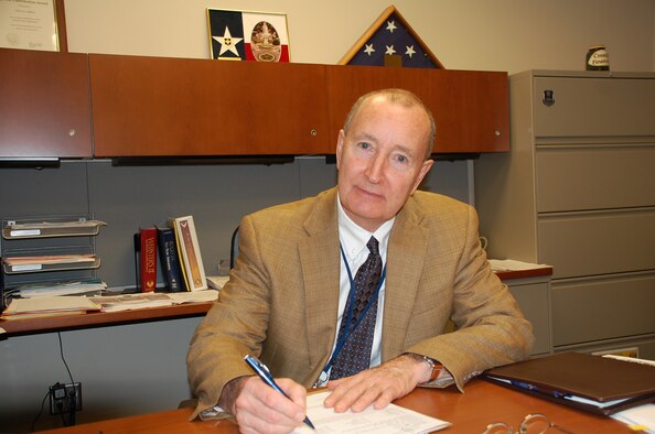 LACKLAND AIR FORCE BASE, Texas -- John LaHue, chief financial officer at the Air Force Center for Engineering and the Environment, was presented a Distinguished Flying Cross during his Dec. 22 retirement ceremony for his service in Vietnam in 1970.