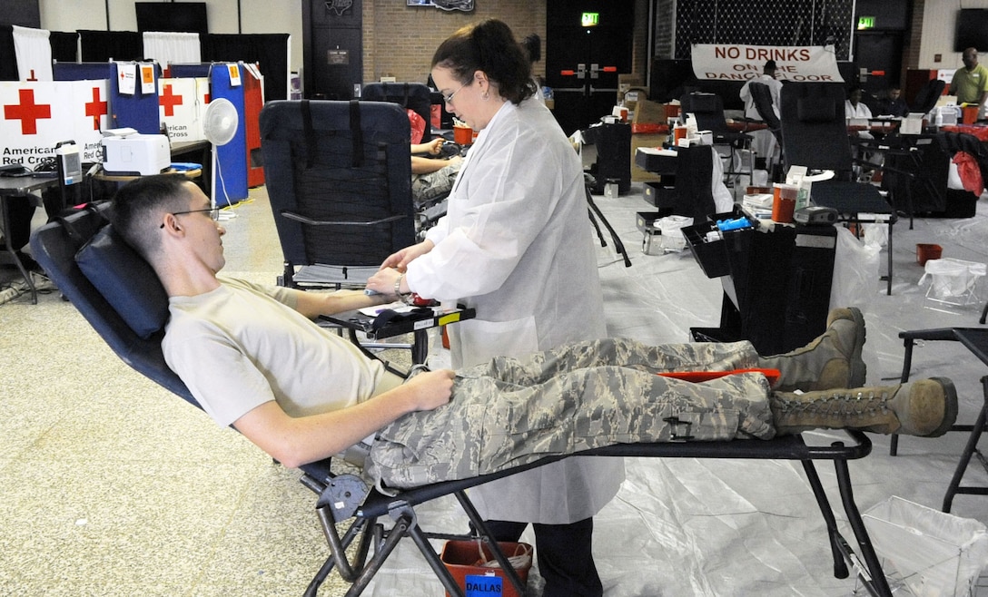 Staff Sgt. Robert Rhoads donates blood during the American Red Cross Blood Drive at Sheppard Air Force Base, Texas, Dec. 14, 2011. The American Red Cross held a three-day drive at the base and collected more than 650 units of blood. (U.S. Air Force photo/Josh Wilson)