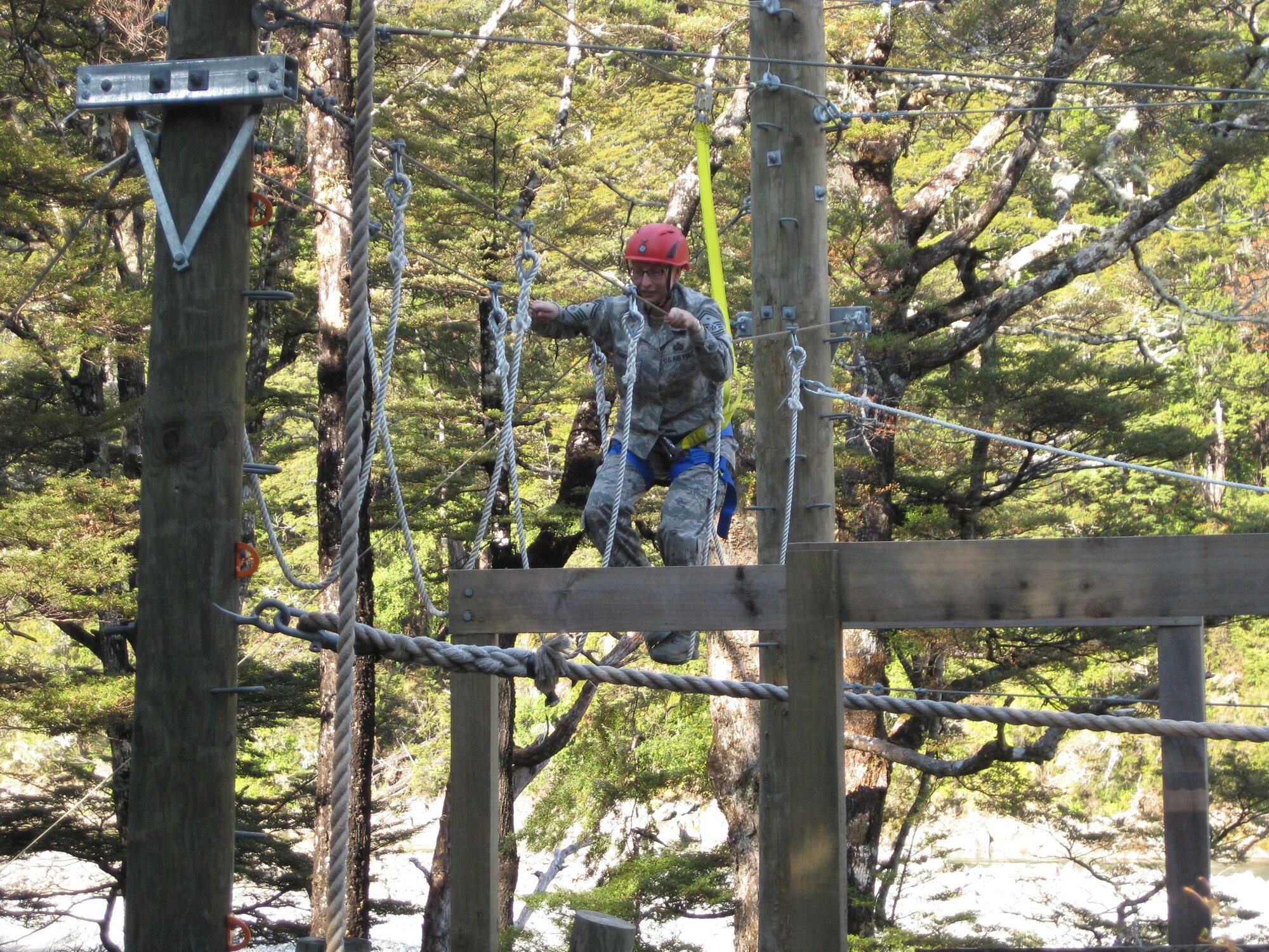 Senior Master Sgt. Nicole Johnson, 613th Air Operations Center first sergeant, completes an obstacle as part of her Royal New Zealand Air Force Warrant Officer Promotion Course Nov. 15, 2011, near Blenheim, New Zealand. (Courtesy photo)