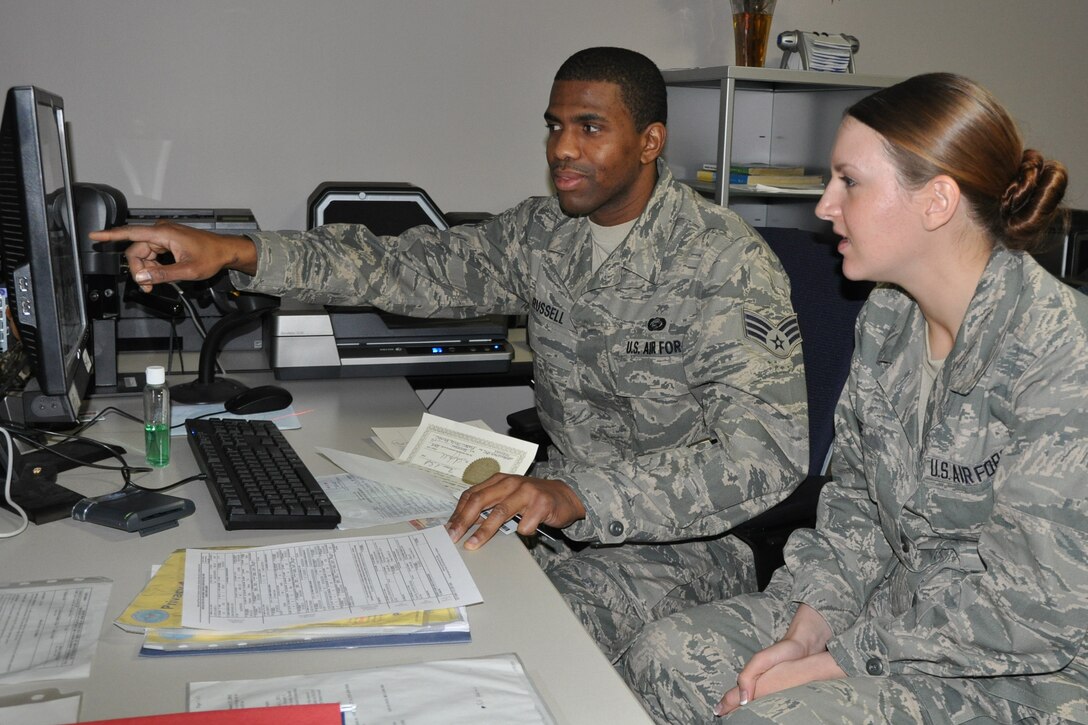 YOUNGSTOWN AIR RESERVE STATION, Oh—Air Force Reserve Senior Airman Steven E. Russell, a Personnel Apprentice with the 910th Force Support Squadron shows Airman Stephanie A. Meade, a Personnel Helper, where to locate a member’s TRICARE health benefits information here during an on-the-job training session December 28. Air Force Reserve Personnel Specialists supervise and perform several activities and functions, including personnel action requests and support commander directed tasks. In addition, they perform enlisted and officer classification, advise airmen on career progression and update military personnel data system records. For more information about an Air Force Reserve career in the Personnel field, go to http://afreserve.com/ U.S. Air Force photo by Maj. Brent J. Davis

