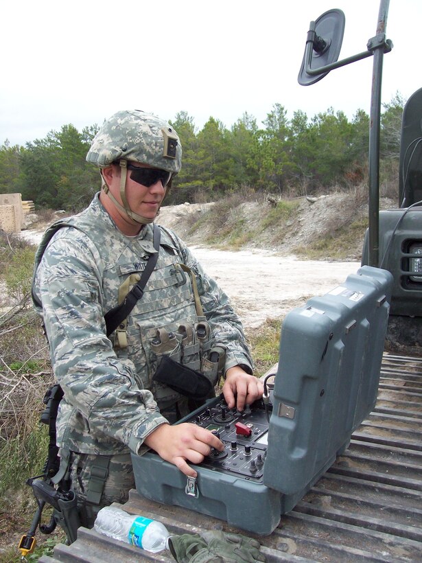 Senior Airman Blake Witte, of the 932nd Civil Engineer Squadron, operates a remote-controlled robot using a portable field unit.  Blake, an explosive ordnance disposal (EOD) specialist, is taking a mandatory four-week course prior to his overseas deployment.  The course is the Combat Battelfield Ready Airman (CoBRA) and is conducted at Tyndall Air Force Base, Fla. The training prepares deploying EOD Airmen in ground combat operations training to include: weapons, radio communications, vehicle operations and intelligence briefings on their AOR.  Additionally,  the course features a mock contingency environment where Airmen can train extensively on  EOD and improvised explosive devices (IED) operations.  Master Sgt. David Pinkham said this type of training can't be duplicated at home station.  Pinkham added that EOD members deploy for six months.  (U.S. Air Force photo)