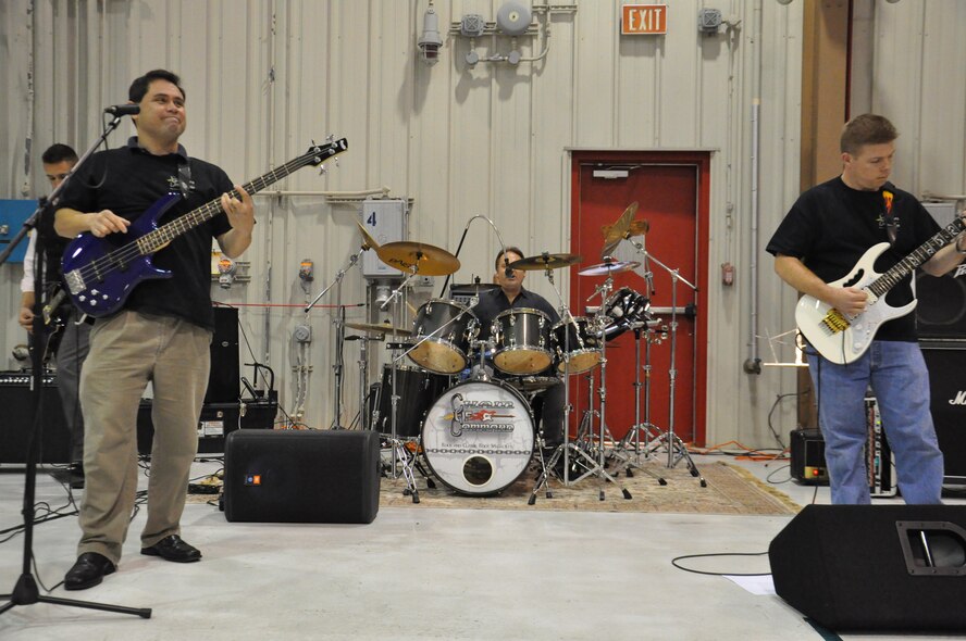 Members of the Chain of Command band play at the 4th Component Maintenance Squadron’s Christmas party on Seymour Johnson Air Force Base, N.C., Dec. 9, 2011. The band members have more than 100 years of experience between them and know more than 90 rock songs. (U.S. Air Force photo by Airman 1st Class Mariah Tolbert)