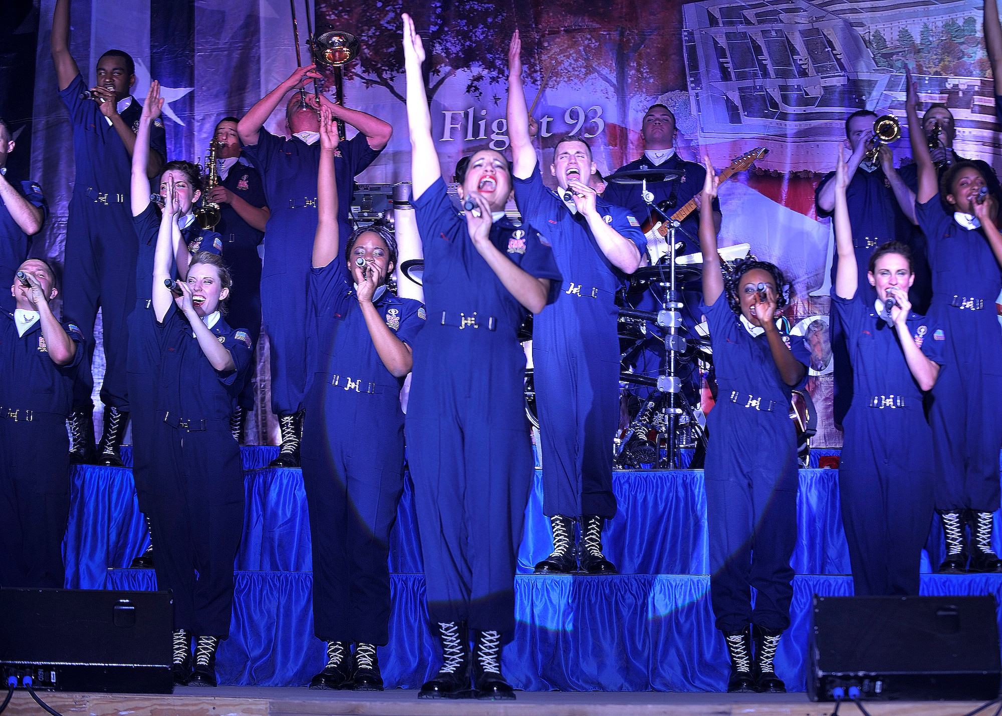 BAGRAM AIRFIELD, Afghanistan— Tops in Blue performers sing the final note of their performance at Bagram Airfield Dec 24, 2011. Tops in Blue consists of singers, dancers and musicians  who are all active-duty Air Force members on a one year permissive TDY. . (U.S. Air Force photo/A1C Ericka Engblom)

