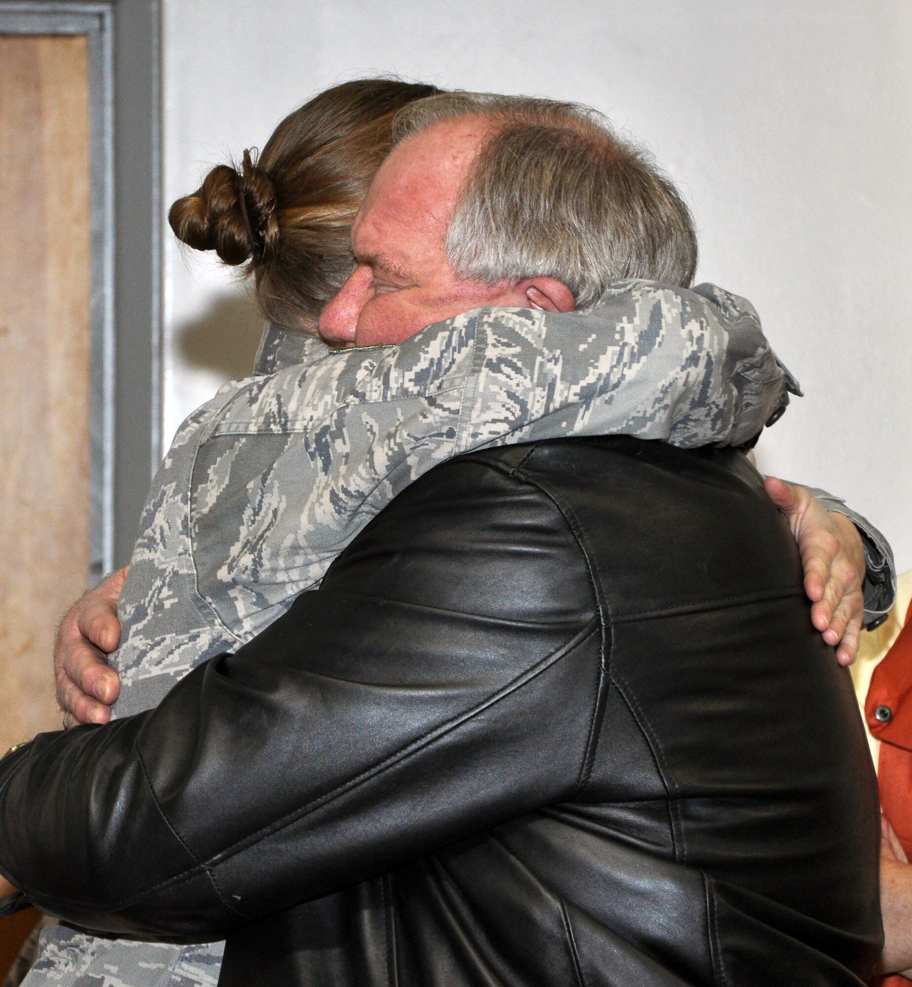 Staff Sgt. Ann Horstmann, 442nd Aircraft Maintenance Squadron weapons loader, hugs her dad before she deployed Dec. 28, 2011. Approximately 130 reservists from the 442nd Fighter Wing deployed to Afghanistan in support of Operation Enduring Freedom. The 442nd FW is an A-10 Thunderbolt II Air Force Reserve unit at Whiteman Air Force Base, Mo. (U.S. Air Force photo/Senior Airman Wesley Wright)