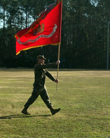Sgt. Maj. John E. Bankus, the sergeant major for 8th Engineer Support Battalion, 2nd Marine Logistics Group, marches with the battalion colors during a change of command ceremony at Soifert Field aboard Camp Lejeune, N.C., Dec. 29, 2011. During the ceremony, Lt. Col. Christopher G. Downs, the outgoing commanding officer, relinquished his authority of the unit to Lt. Col. Ferdinand F. Llantero. (U.S. Marine Corps photo by Pfc. Franklin E. Mercado)