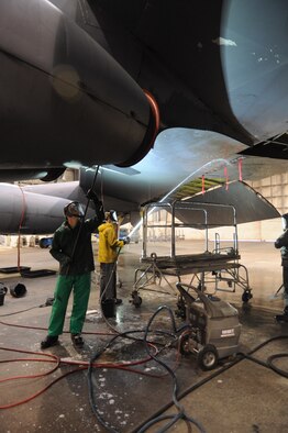 Airmen 1st Class Eric Dearing and Airman 1st Class Sean Minnis, 2nd Aircraft Maintenance Squadron wash a B-52H Stratofortress in the Corrosion Control Facility on Barksdale Air Force Base, La., Dec. 19. Each part of the plane is meticulously scrubbed to prevent build-up of grime. (U.S. Air Force photo/Senior Airman Kristin High)(RELEASED)