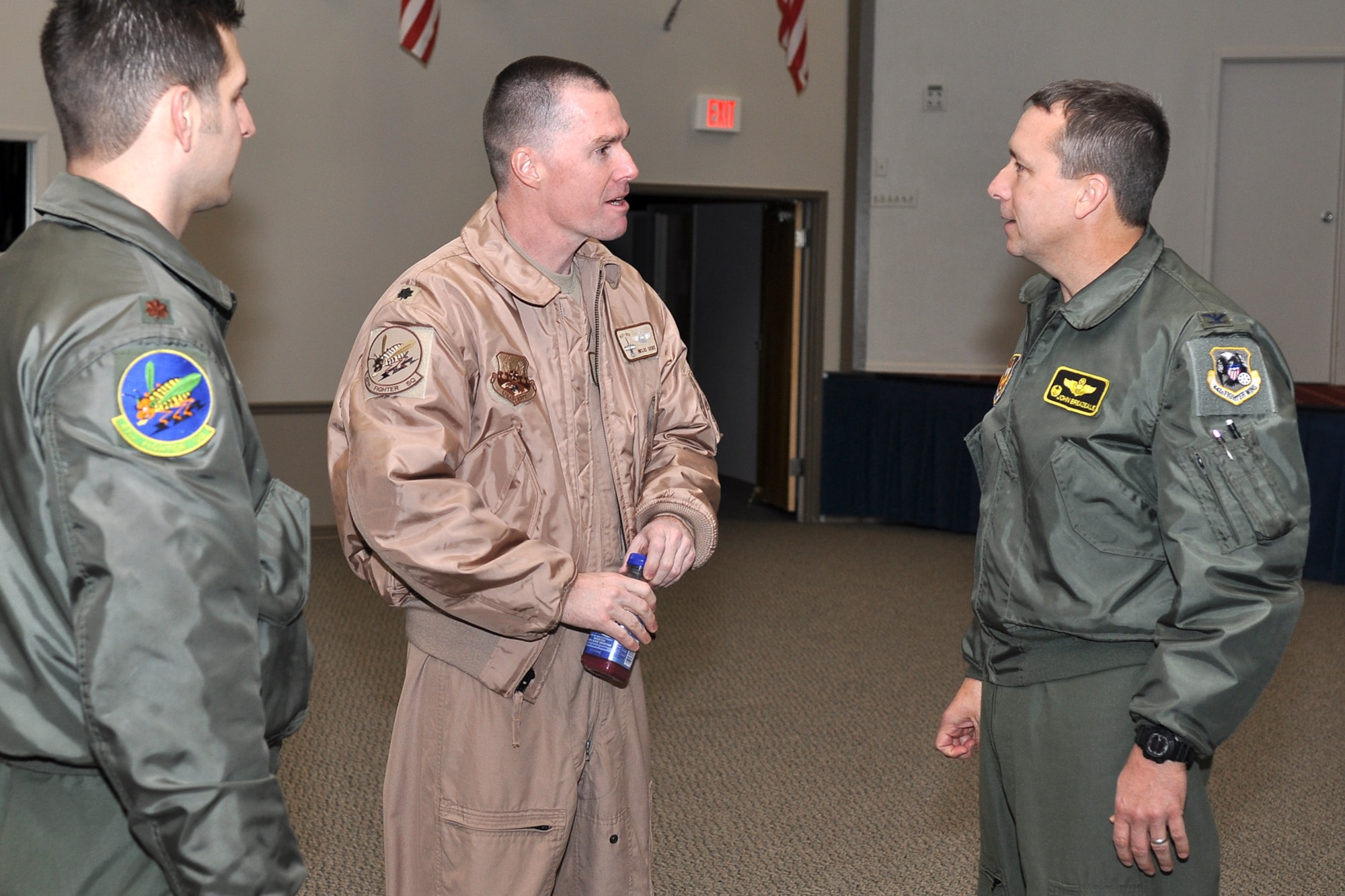 Col. John Breazeale at right, commander of the 917th Fighter Group, converses with two 47th Fighter Squadron pilots at Hoban Hall on Barksdale Air Force Base, La., Dec. 28, 2011.   The pilots assigned to the 47th Fighter Squadron, are a part of approximately 124 Airmen who deployed from the 917th FG to Afghanistan in support of Operation Enduring Freedom. The 917th FG is an A-10 Thunderbolt II Air Force Reserve unit. (U.S. Air Force photo by Master Sgt. Jeff Walston)