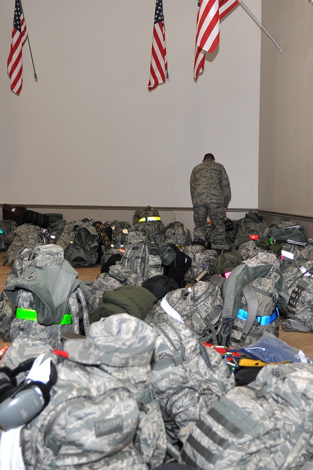 Master Sgt. Henry May, avionics supervisor for the 917th Aircraft Maintenance Squadron, checks his bag before entering the processing line at Hoban Hall on Barksdale Air Force Base, La., Dec. 28, 2011. May is just one of approximately 124 Airmen from the 917th Fighter Group who deployed to Afghanistan in support of Operation Enduring Freedom. The 917th FG is an A-10 Thunderbolt II Air Force Reserve unit. (U.S. Air Force photo by Master Sgt. Jeff Walston)
