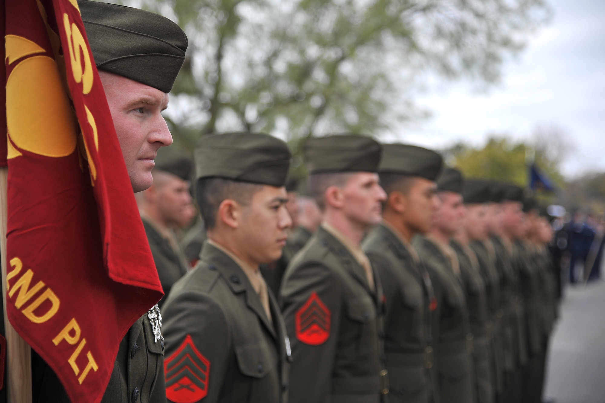 SAN ANGELO, Texas-- Marines from the Marine Corps Detachment at Goodfellow Air Force Base stand in formation for the annual Hunt for Heroes parade in downtown San Angelo along Park Drive Nov. 18, 2011. The parade pays tribute to 25 wounded Iraq and Afghanistan combat veterans, which includes a West Texas hunting trip as well as numerous other events and activities. (U.S Air Force photo/Airman 1st Class Michael Smith)