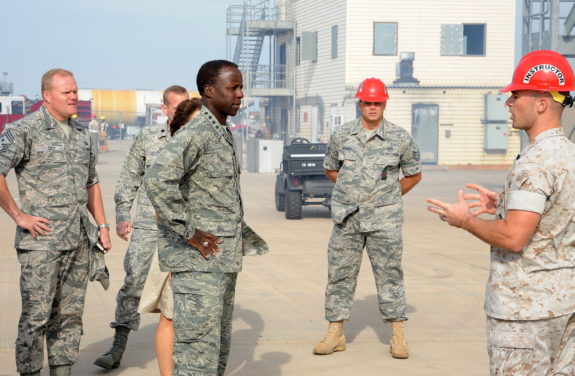 GOODFELLOW AIR FORCE BASE, Texas -- Gen. Edward Rice, Commander of Air Education and Training Command, receives a briefing from Marine Gunnery Sgt. Jason Goulter, Fire Academy Instructor, as Tech. Sgt. Frank Pyner, Fire Academy Instructor, looks on during the general's visit here Sept. 14-15. (U.S. Air Force photo/Airman 1st Class Michael Smith)