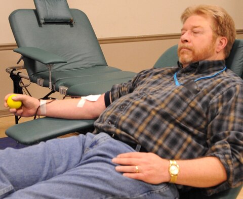 Craig Pearson, 2nd Communications Squadron senior information technology specialist, relaxes in a lounger during a LifeShare blood drive at Hoban Hall on Barksdale Air Force Base, La., Dec. 28. There are eight possible types of blood: A, B, AB or O, which are either designated positive or negative types. Individuals with type O negative blood are especially welcome to donate because their blood can be transfused to anyone in an emergency situation. (U.S. Air Force photo/2nd Lt. Tori Lalich)(RELEASED)