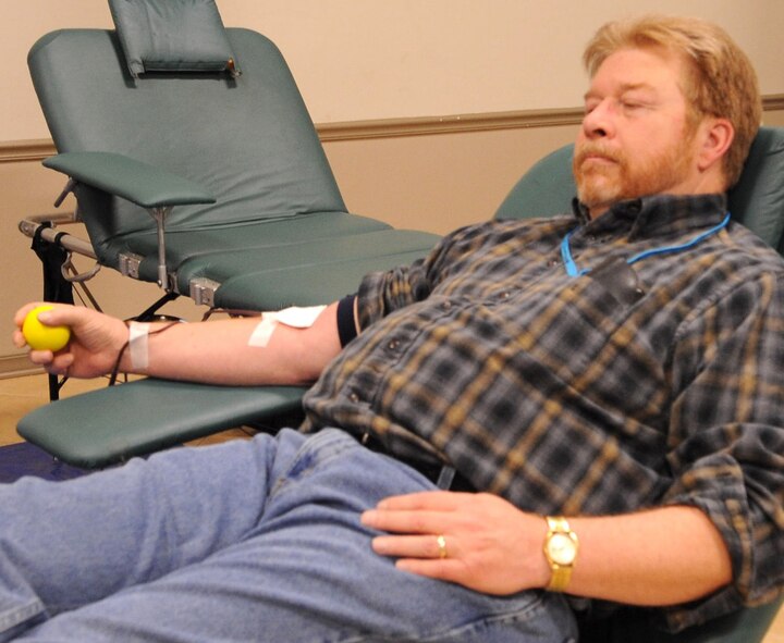 Craig Pearson, 2nd Communications Squadron senior information technology specialist, relaxes in a lounger during a LifeShare blood drive at Hoban Hall on Barksdale Air Force Base, La., Dec. 28. There are eight possible types of blood: A, B, AB or O, which are either designated positive or negative types. Individuals with type O negative blood are especially welcome to donate because their blood can be transfused to anyone in an emergency situation. (U.S. Air Force photo/2nd Lt. Tori Lalich)(RELEASED)