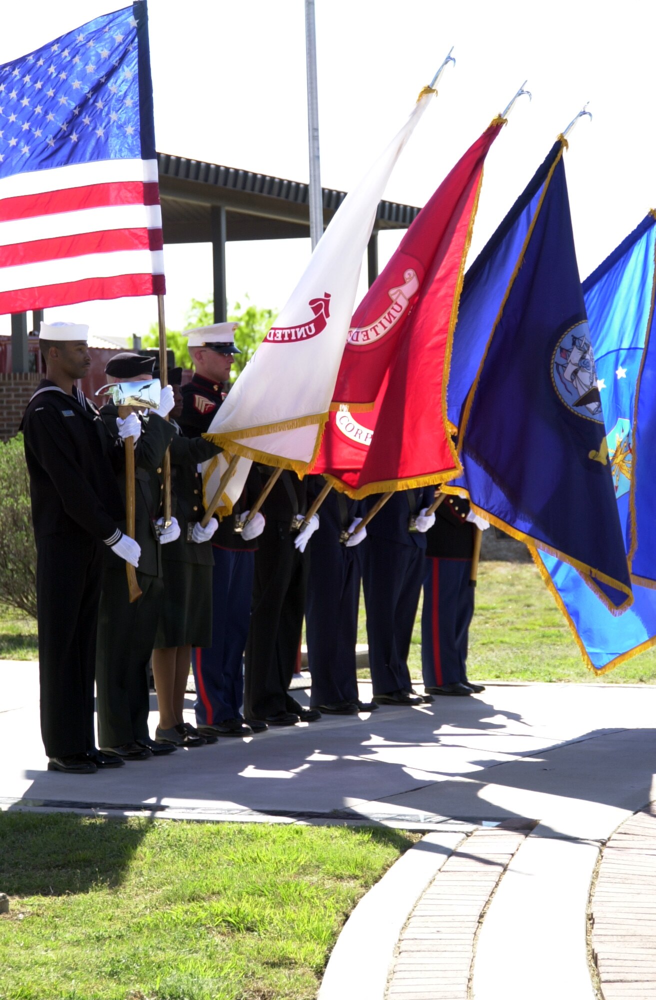 GOODFELLOW AIR FORCE BASE, Texas -- Louis F. Garland Joint Service Color Guard members post the Colors at the Department of Defense Fallen Firefighter Memorial here during a Military Firefighter Heritage Foundation ceremony April 1, 2011 where the names of three fallen DOD firefighters were added to the memorial. There are now 82 names etched in stone at the memorial. (U.S. Air Force photo/Connie Hempel)