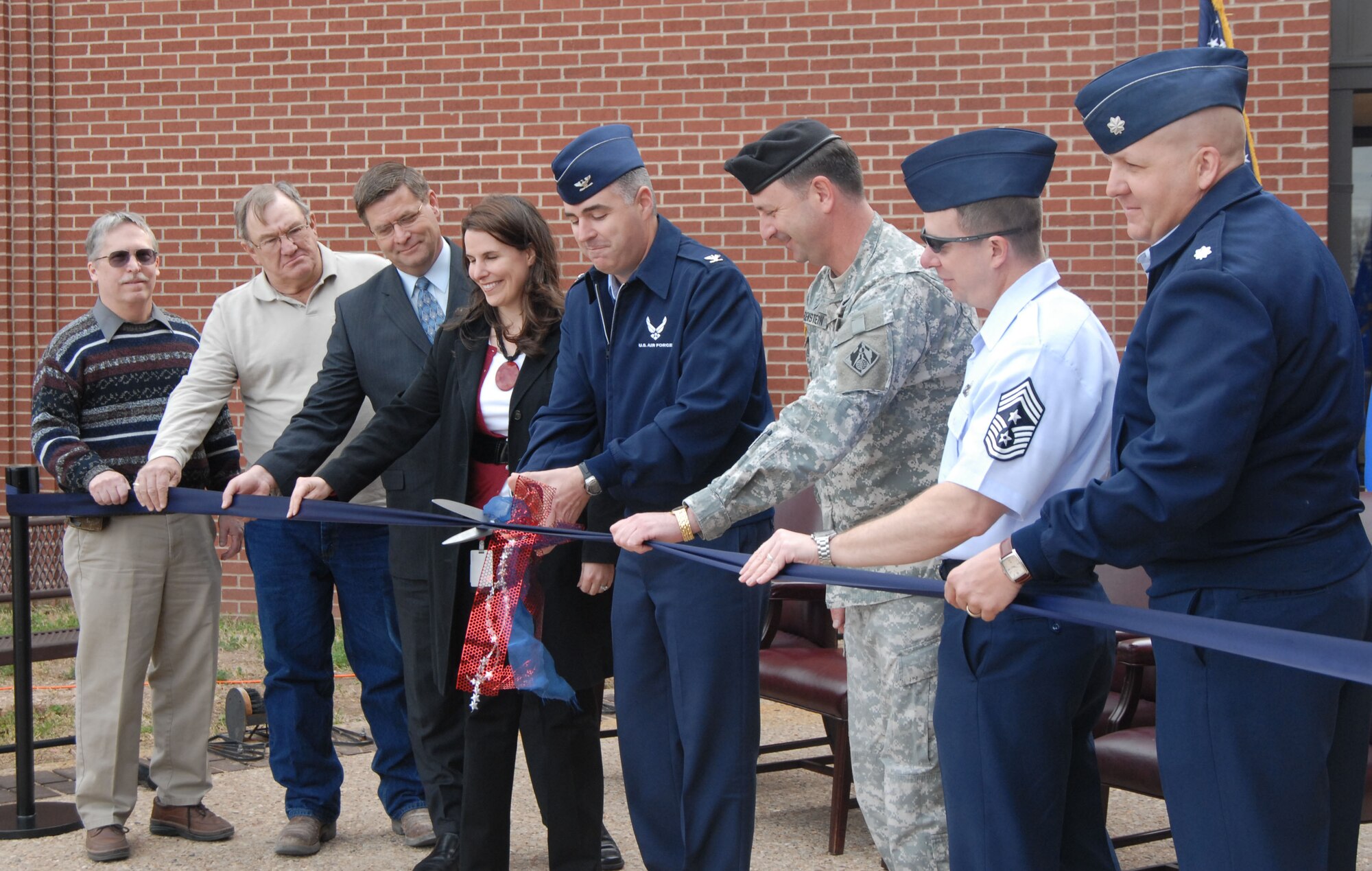 GOODFELLOW AIR FORCE BASE, Texas-- Col. Thomas Geary, then 17th Training Wing Commander, and representatives from Goodfellow, the San Angelo community and the Army Corps of Engineers cut a ribbon during a ceremony March 7, 2011. The event marks the official opening of the expanded area of the Mathis Fitness Center, which adds 15,000 sq. feet to the facility. (U.S. Air Force photo/Airman 1st Class Jessica Keith)

