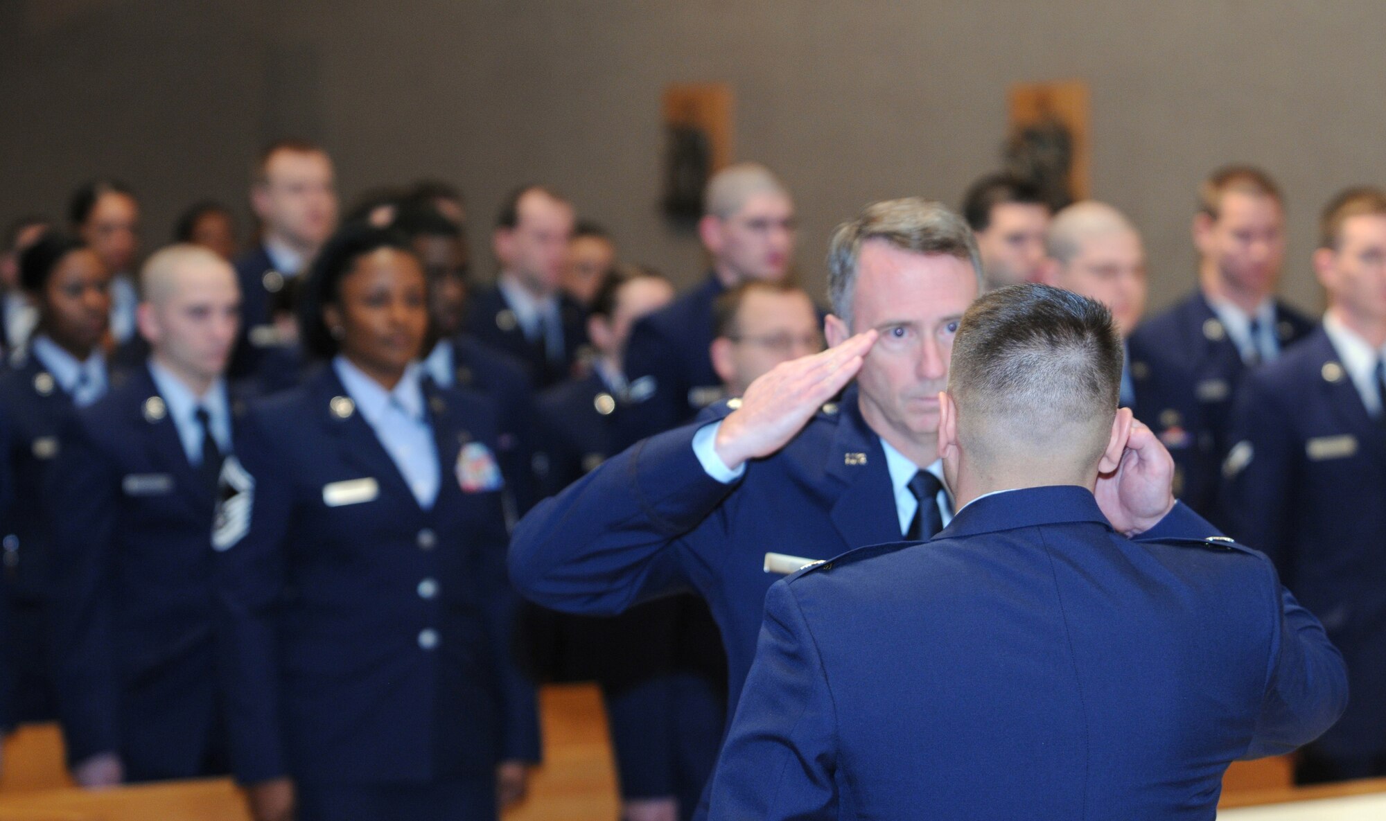 PENSACOLA, Fla. – Air Force 316th Training Squadron Commander Lt. Col. Erick J. Lawson renders a salute to 17th Training Group Deputy Commander Lt. Col John A. Cupp III during a deactivation ceremony for the 313th Training Squadron at the chapel on board Corry Station Jan. 11. (U.S. Navy photo by Gary Nichols)