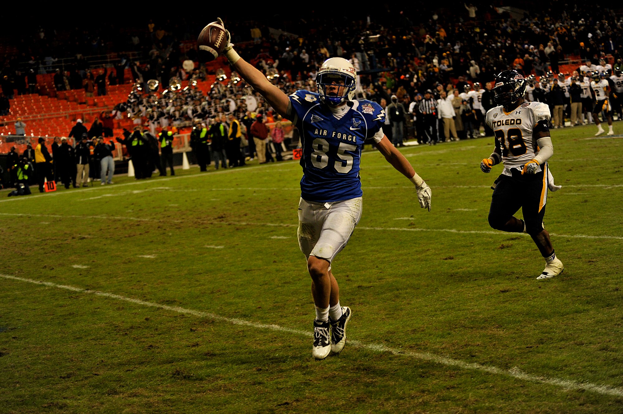 Air Force wide receiver Zack Kauth catches a pass and runs it in for a touch down on December 28, 2011 at RFK stadium against Toledo University for the 2011 Military Bowl. Toledo won the game with a 42-41 victory. (U.S. Air Force Photo by: MSgt Jeremy Lock) (Released)
