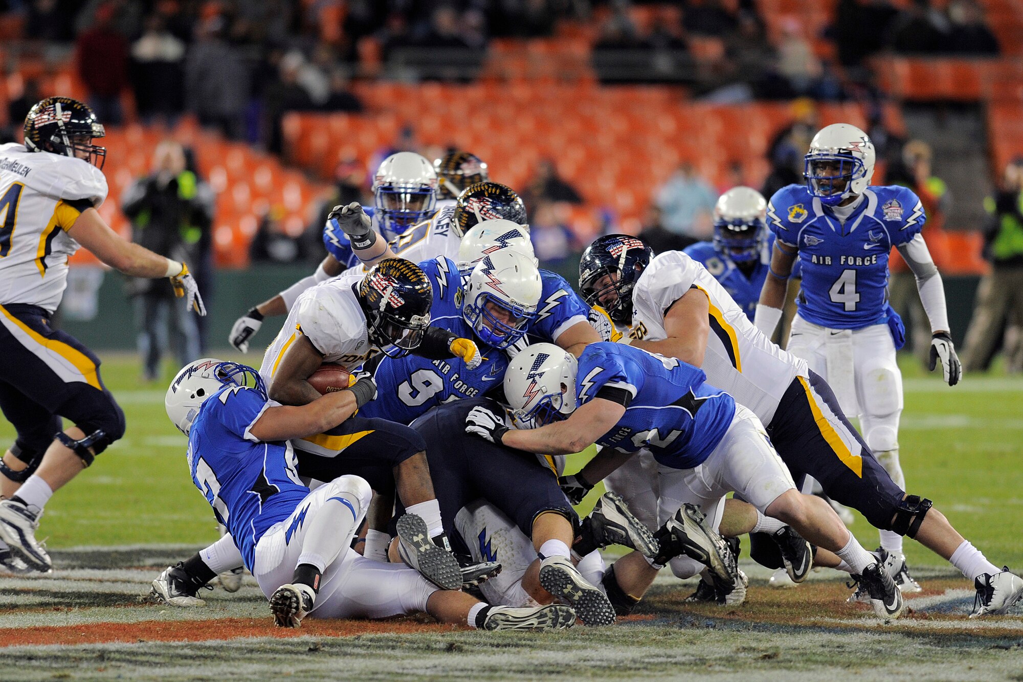The Air Force Academy defense hauls in a Toledo running back at RFK Stadium Dec 28, 2011 in Washington DC.  The Falcons played the Toledo Rockets in the Military Bowl.   (Air Force photo/Ray McCoy)