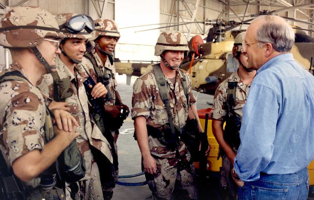 Defense Secretary Dick Cheney talks with soldiers of the 82nd Airborne Division in Saudi Arabia, Aug. 19, 2011. The paratroopers were recently deployed to an air base in Saudi Arabia as part of Operation Desert Shield. The division was the first large US ground combat force to arrive in Saudi Arabia after the invasion of Kuwait by Iraq on Aug. 2, 1990.