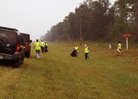 Air Force reservists from Duke Field, Fla., fan out to remove litter along State Road 85 near the base recently. More than a dozen 919th Special Operations Wing volunteers worked for several hours on the First Sergeants Council’s Adopt-A-Highway Program cleanup project that removed more than 500 pounds of litter to help beautify the busy route between the nearby communities of Niceville and Crestview. (Courtesy photo)