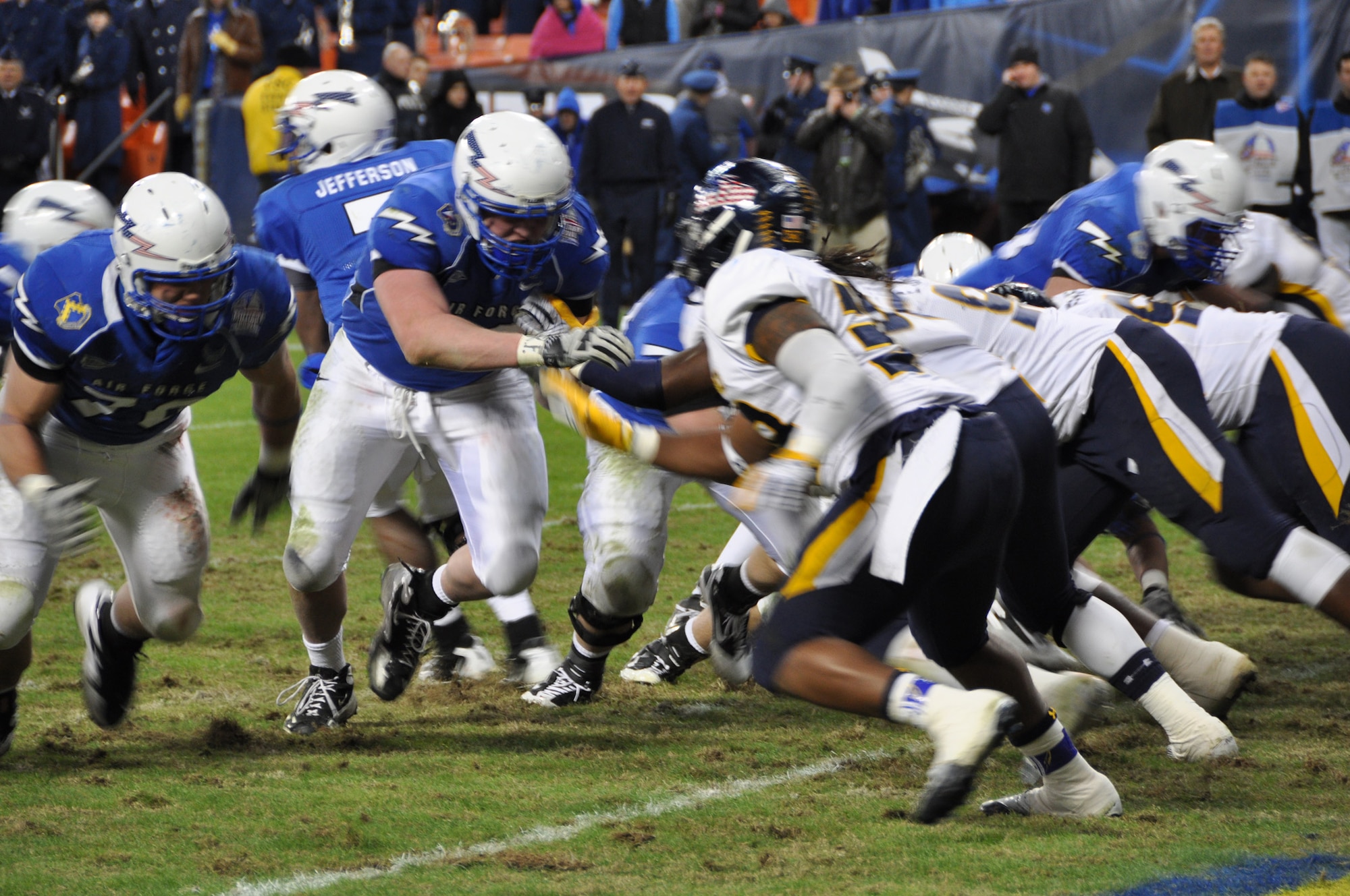 The Air Force Academy's offensive line holds back the Toledo Rocket's defense prior to scoring at the 2011 Military Bowl at Robert F. Kennedy Stadium Dec. 28, 2011 in Washington, D.C. (U.S. Air Force photo/Senior Airman Bobby Pilch)