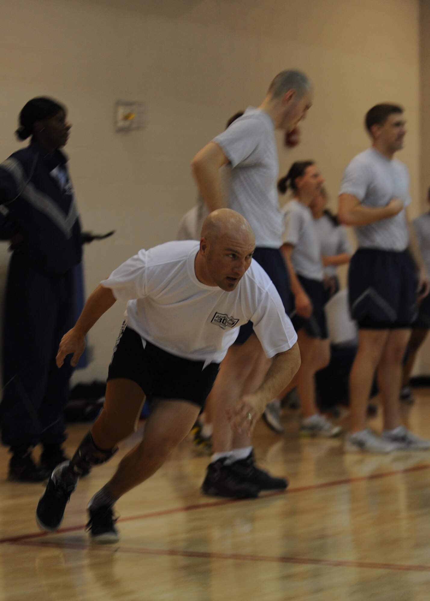 MINOT AIR FORCE BASE, N.D. – Chad Crittenden, athlete and Survivor season 9 competitor, sprints with Minot Airmen here, Dec. 14. Crittenden is apart of the American300 Never Quit Tour. The American300 tour consists of amputees who fought through their physical disabilities to become outstanding athletes. The purpose of the tours is to encourage and build resiliency among U.S. Forces around the world. (U.S. Air Force photo/Senior Airman Ashley N. Avecilla)